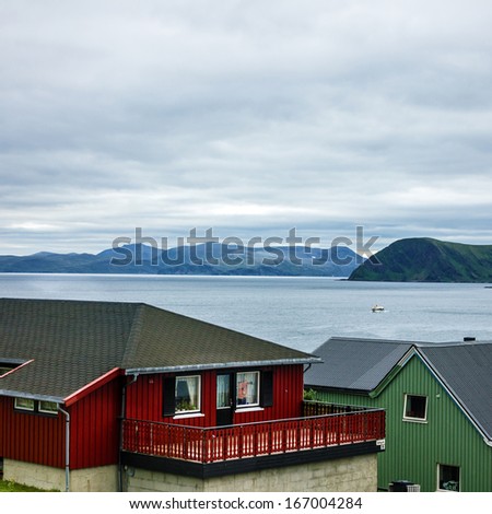 Small rural Scandinavian houses in Norway fjords