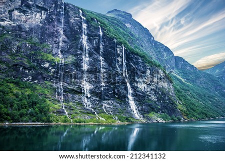 waterfalls Seven Sisters, Geiranger fjord, Norway landscape with mountains.