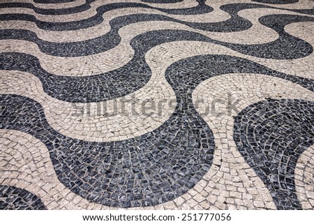 tiled floor. Waves of tiled floor in Portuguese traditional style, Rossio square, Lisbon