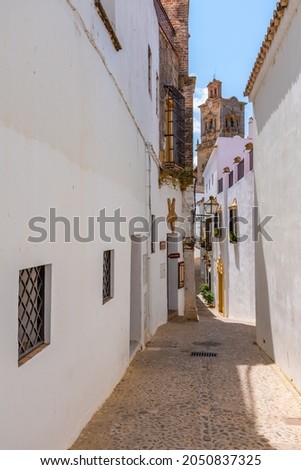 Whitewashed street of the old town of Arcos de la Frontera, one of pueblos blancos, in Spain Stockfoto © 