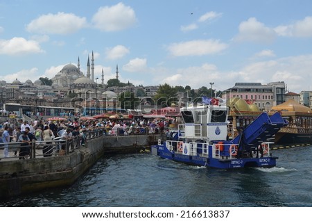 ISTANBUL, TURKEY, AUGUST 22, 2014: People are passing by eminonu pier in order to get to the galata bridge in istanbul.