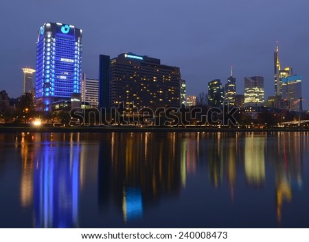 FRANKFURT, GERMANY, NOVEMBER 14, 2014: Skyline of skyscrapers in Frankfurt reflected on the surface of main river.