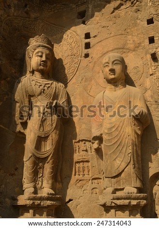 LUOYANG, CHINA, AUGUST 27, 2013: detail of buddha statues and various decoration in longmen grottoes complex, where thousands of buddha statues are carved into the rock.