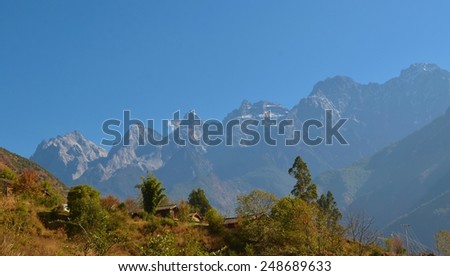 QIAOTOU, CHINA, NOVEMBER 20, 2013: view of the jade dragon snow mountain taking from the upper path of tiger leaping gorge track in china.