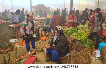 BADA, CHINA, NOVEMBER 18, 2013: traditional market taking place in chinese mountain village bada which is situated among yuanyang rice terraces in yunnan province.