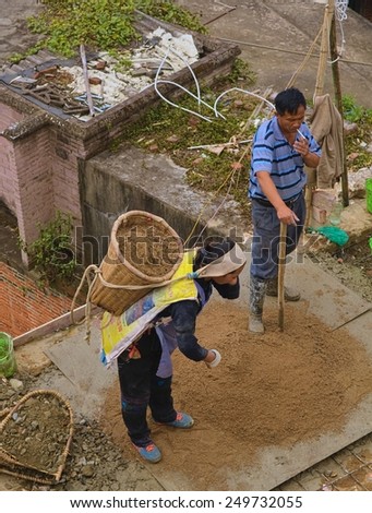 XINJIE, CHINA, NOVEMBER 18, 2013: chinese family is building their house in chinese city xinjie.