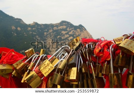 HUANSHAN, CHINA, AUGUST 26, 2013: Detail of love locks locked on the top of huanshan mountain in china.