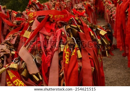 HUASHAN, CHINA, AUGUST 26, 2013: top of huashan mountain in china is decorated by love locks and red ribbons.