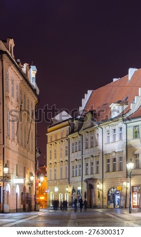 PRAGUE, CZECH REPUBLIC, JANUARY 30, 2015: people are walking towards the old town square in prague through alley leading from the powder tower / prasna brana.