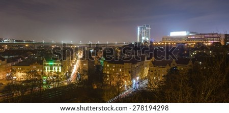 night view of the prague congress center, nuselsky bridge and valley filled with houses below them in prague.