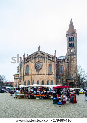POTSDAM, GERMANY, MARCH 11, 2015: open market is taking place in front of the saint peter and paul church in potsdam, germany.