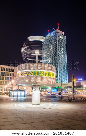 BERLIN, GERMANY, MARCH 12, 2015: Night view of world clock with Park Inn hotel behind situated on Alexanderplatz in German capital Berlin.
