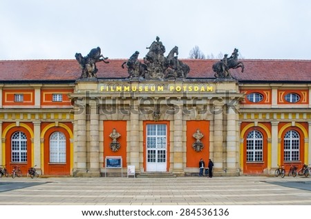 BERLIN, GERMANY, MARCH 12, 2015: long orange building of film museum in potsdam, germany.