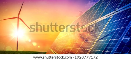 Wind Turbines And Solar Panels At Sunset - Renewable Energy Concept Stock fotó © 