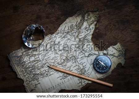 Old compass and vintage map