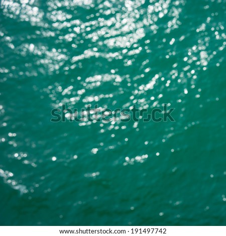 Abstract circular bokeh background of Light shining on the sea, Abstract sea shot in manual mode out of focus.