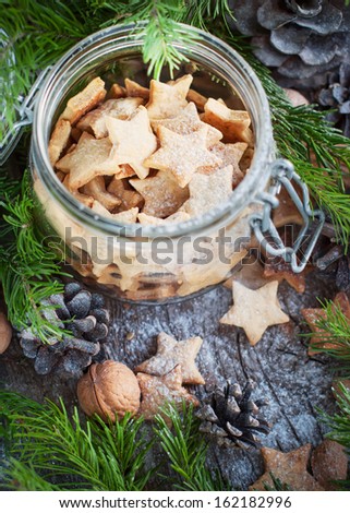 Christmas Cookies Stars in the glass jar with Fir Tree, top view