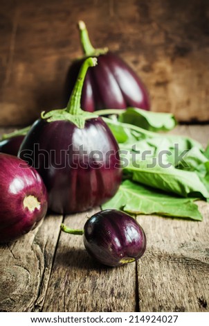 Fresh Organic Eggplants on the Wooden Table, still life