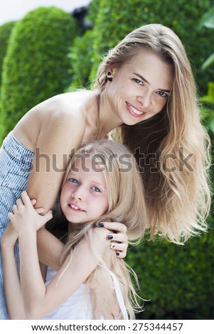 Beauty mother and daughter. Happy relationship. Hugging