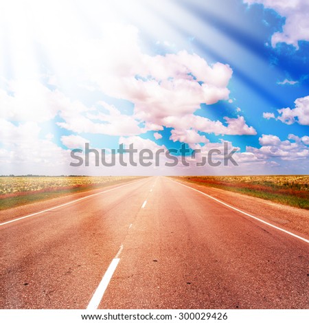 Rural Road Lies in a Field and Comes to the Horizon. The Route in Russia. Ray effect