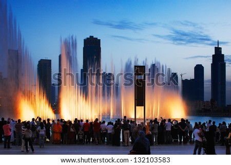 DOWNTOWN DUBAI, UAE - MAY 14: The Dubai Fountain on May 14, 2010 in Dubai, UAE. It is one of UAE most famous attractions, lit by 6600 lights and 50 projectors it shoots water 150 m into the air.