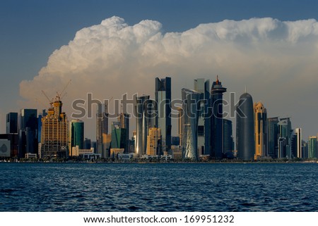 DOHA, QATAR - NOV 14: Iconic new towers grace the skyline of the West Bay area of Doha on Nov 14, 2013 in Doha, Qatar. The West Bay is considered as one of the most prominent districts of Doha