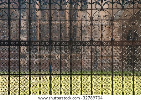 Dense pattern of wrought iron fence in Cambridge, UK