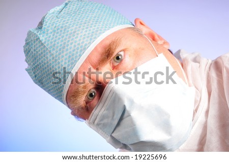 Doctor or medical worker in a hat and mask head tilt concern
