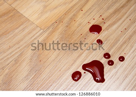 Drops of blood on laminate floor texture
