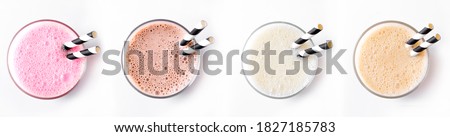 Set of delicious Milk Shakes or Smoothies isolated on white background. Various protein shakes,  strawberry, chocolate, vanilla, caramel energy drinks, top view.