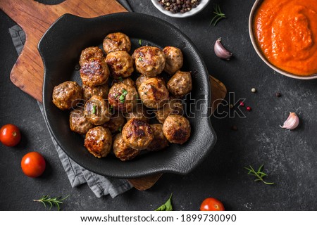 Fryed meatballs on black background, top view, copy space. Beef roasted meatballs ready for eat.