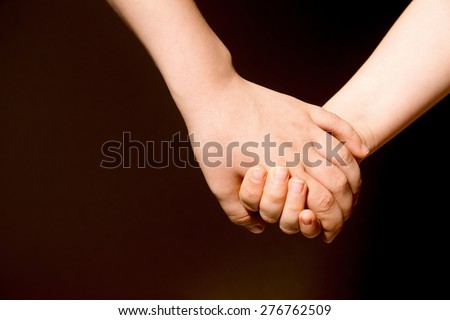 Friendship forever concept. Children holding hands, close up, copy space.