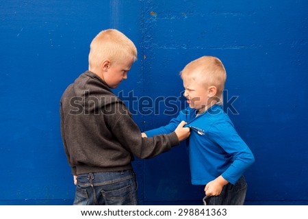 children fight between two angry aggressive brothers (kids, boys)
