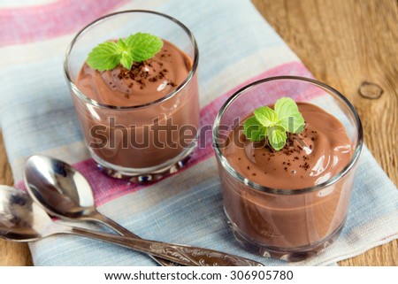 Chocolate mousse with mint in portion glasses