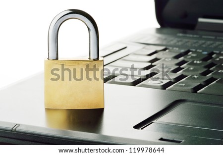 Padlock on notebook keyboard, symbolizing computer related security