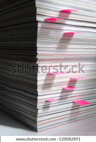 A stack of magazines with place holders