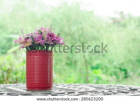 beautiful flower in canned D.I.Y (Do it yourself) the decoration on table in vintage style