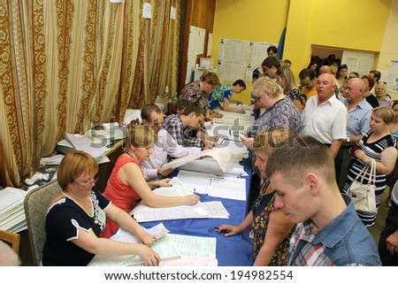 Kiev, Ukraine - May 25, 2014: Election of the President of Ukraine and Kiev measure. A crowd of people stood in line to vote.