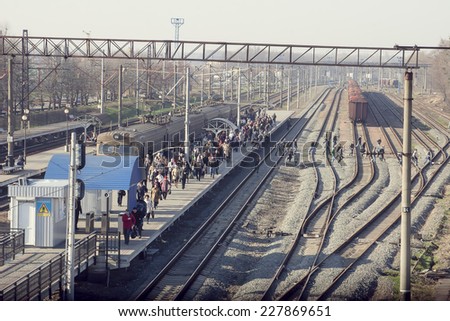 Kiev, UKRAINE - 17 April 2013: People to come by an electric train and hurry to work