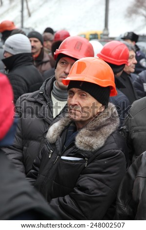 KIEV, UKRAINE - 28 January 2015: Miners rally around Cabinet of Ministers. People require provide salaries and increase funding for the coal industry