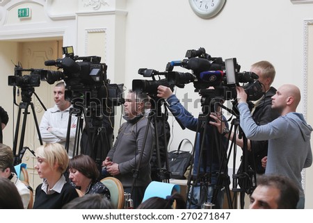 Kiev, UKRAINE - 16 April 2015: Meeting of the Parties employers, trade unions and the state. Video operators recorded on camera speech policy