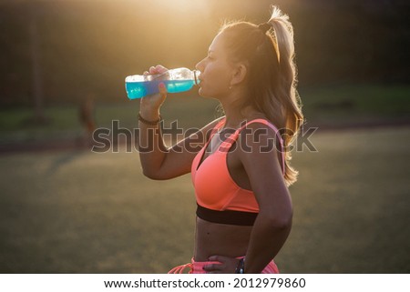 Similar – Image, Stock Photo Woman drinking isotonic drink while resting