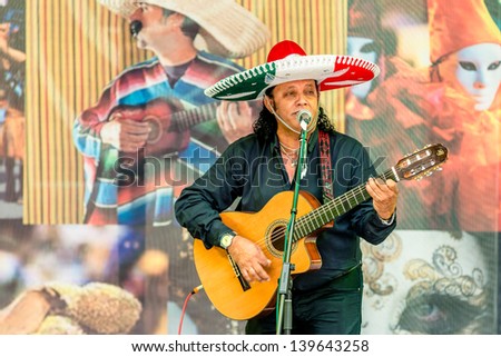 MOSCOW, RUSSIA - 18 MAY: Participant of annual carnival in Moscow in Ermitage Garden - latin guitar player and singer. Moscow, 18 may, 2013