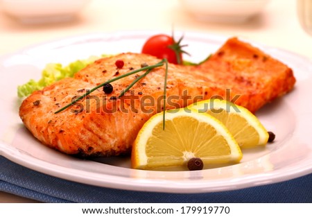 Grilled salmon filet and vegetables, close up