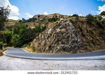 Curvy mountain road in Mediterranean mountains, downhill