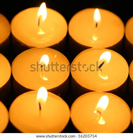 sacred candles in dark