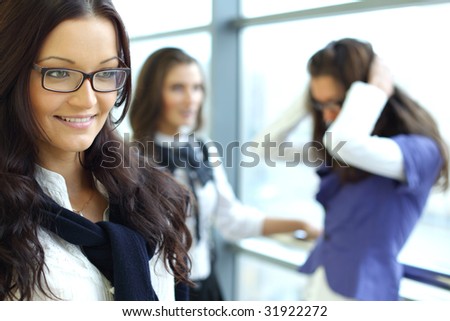Businesswoman meeting smiley girl face on foreground