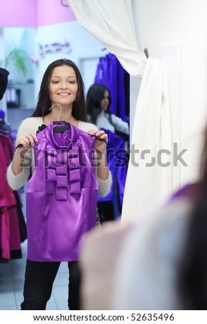 woman in dress room wear dress