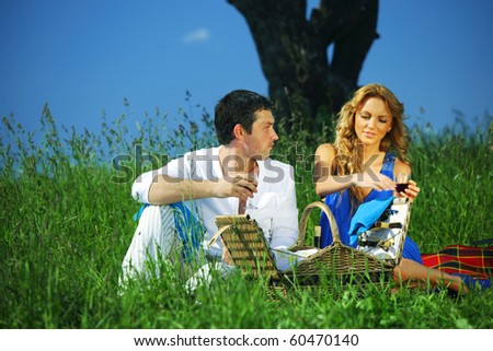 man and woman on picnic