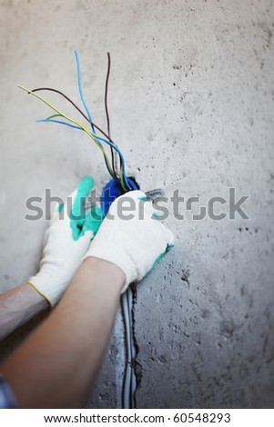 worker puts the wires